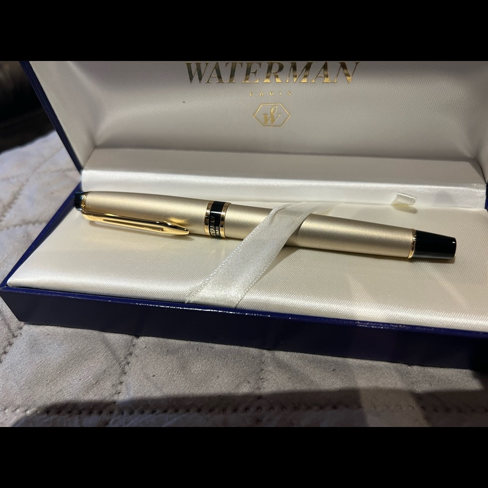 Waterman new in box gold ink pen.This was a gift and has never been used.